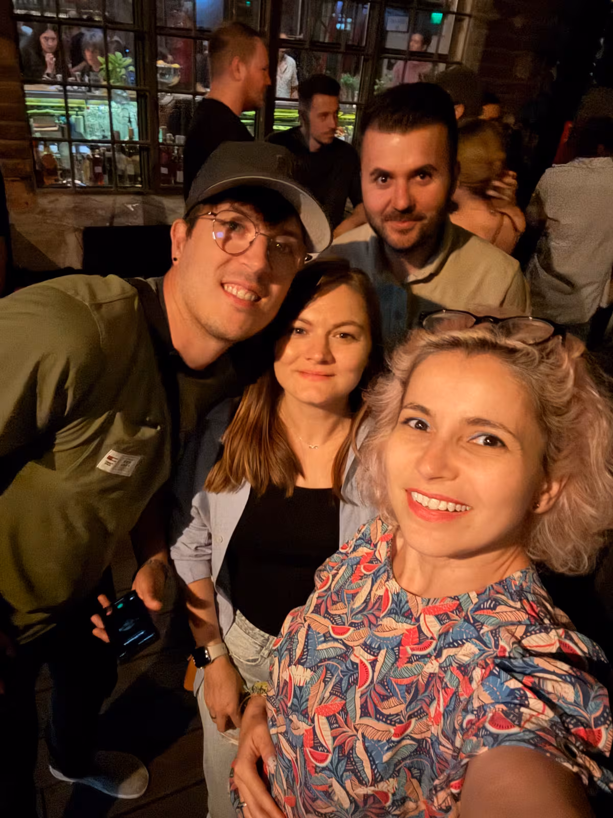 Three members taking a selfie at an evening meetup
