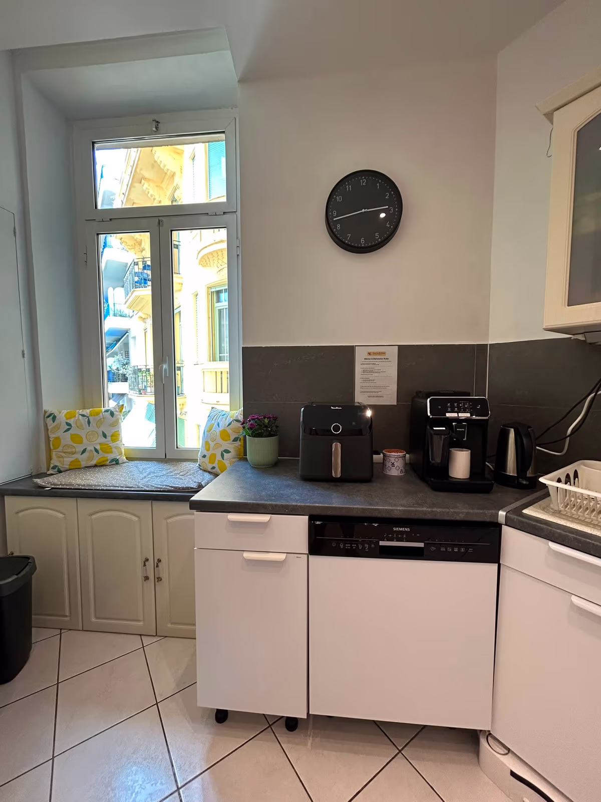 The kitchen window seat next to the coffee machine, air fryer and kettle